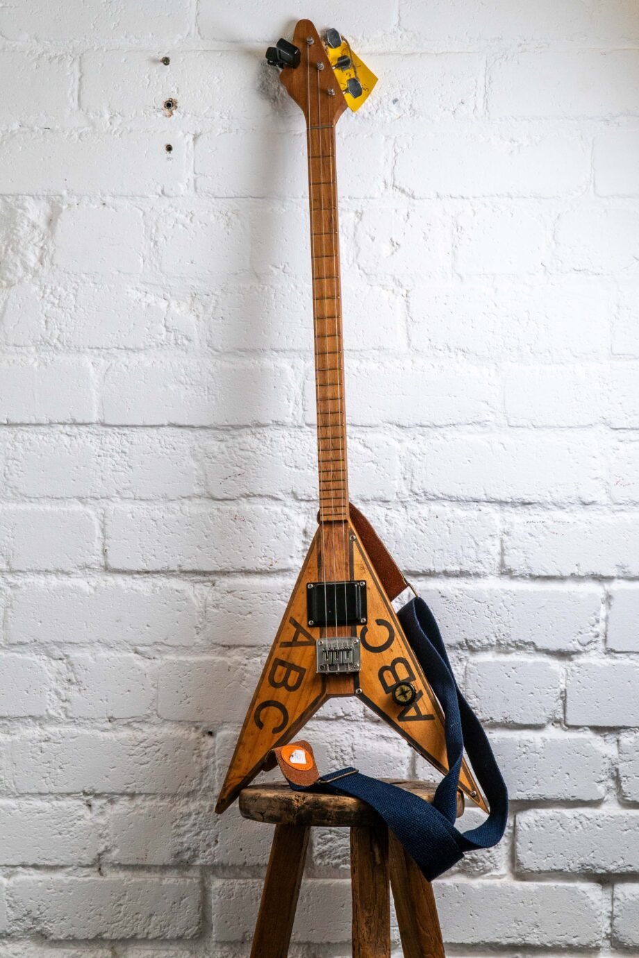 Flying V three strings guitar